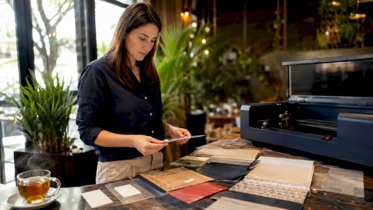 Crafter reviewing various craft materials at workstation