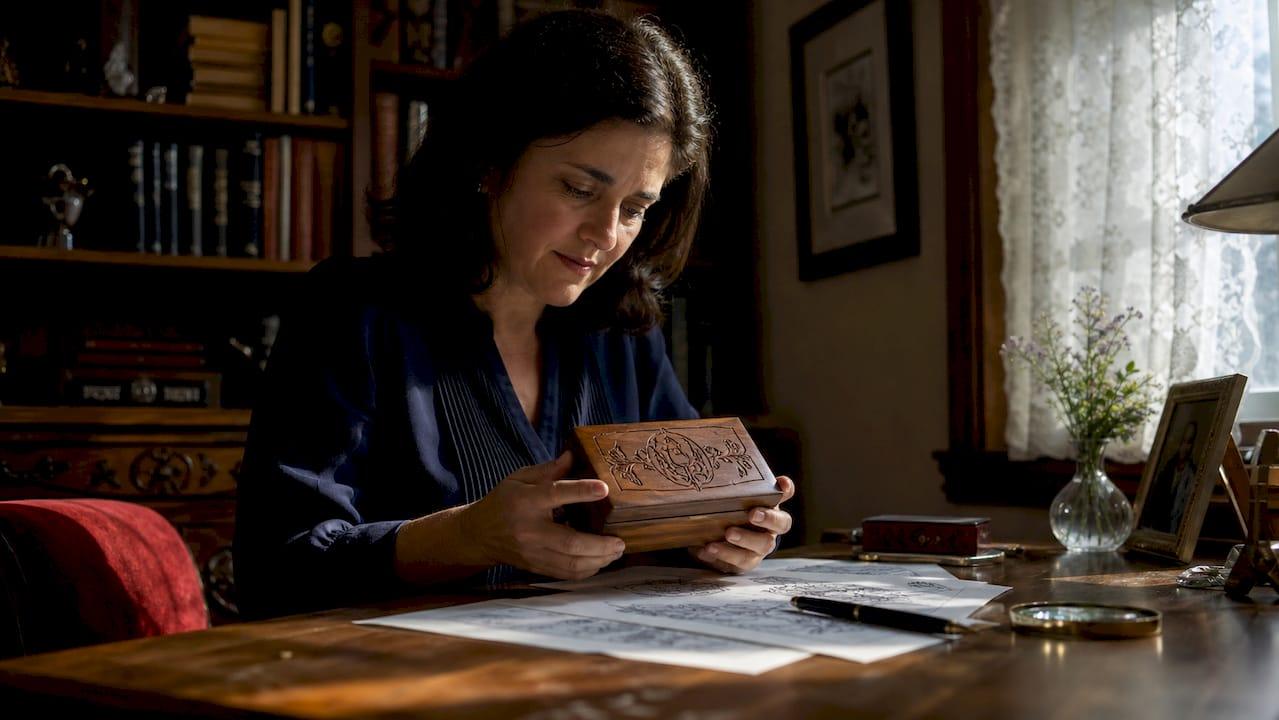 Woman inspecting engraved gift box at home