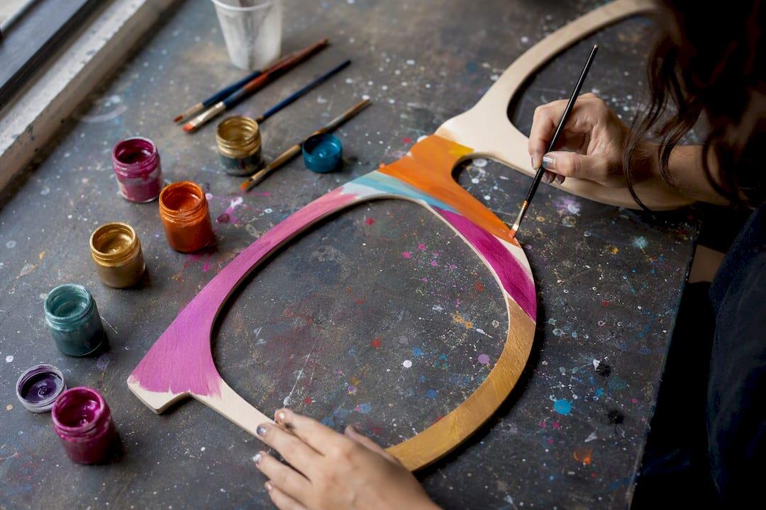 Hand painting large wooden sunglasses party prop