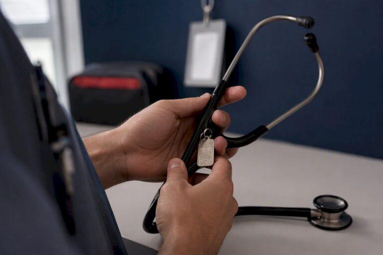 Hands holding stethoscope with custom engraving
