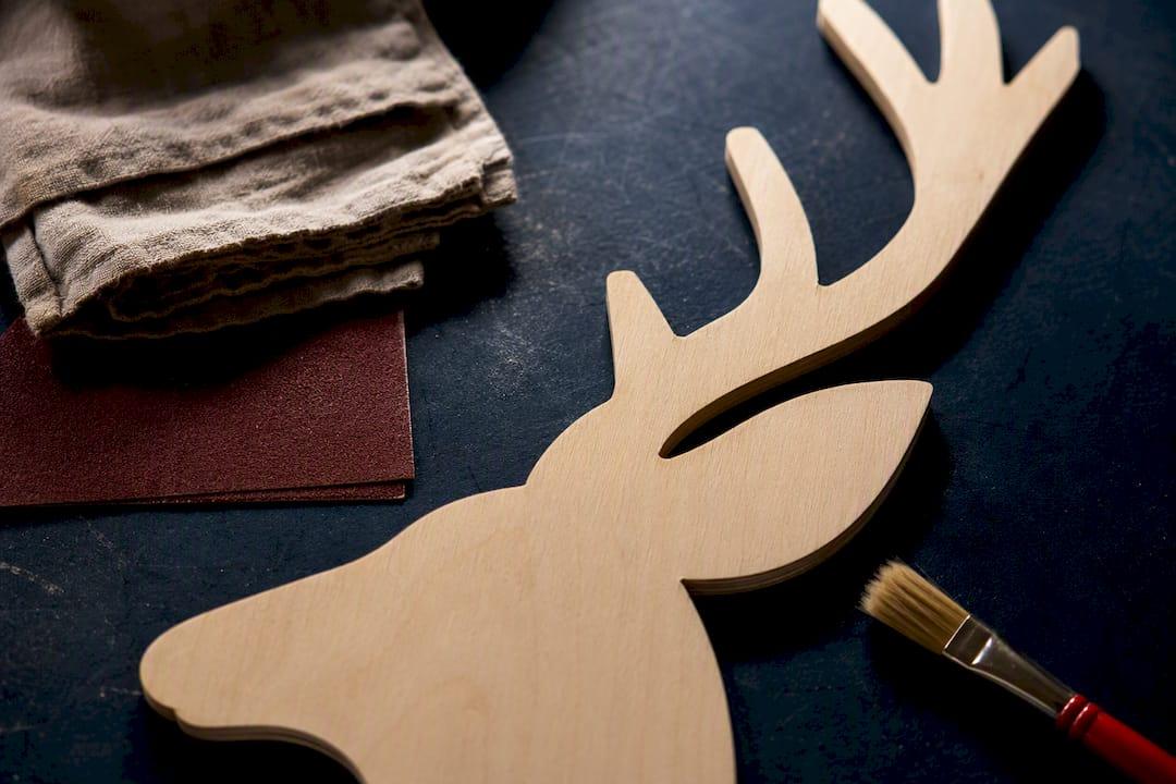 Close detail of unfinished plywood deer cutout