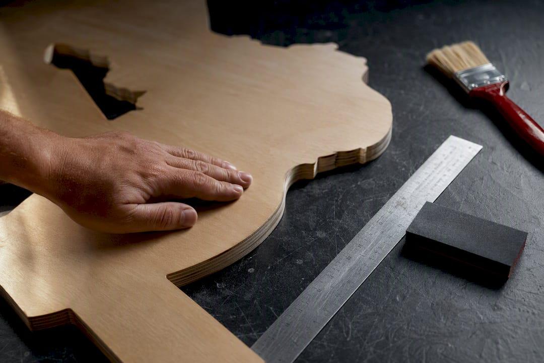 Partial firefighter wood cutout being finished