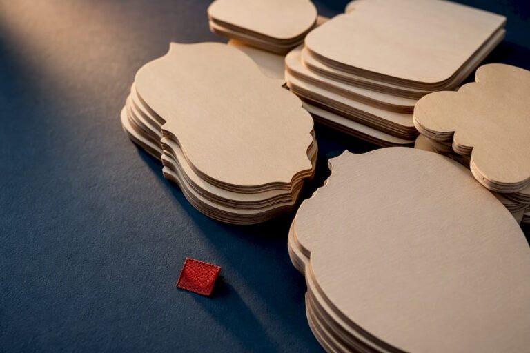 Anonymous stacked laser-cut wood shapes