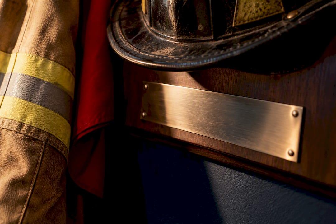 Engraved plate beneath firefighter gear