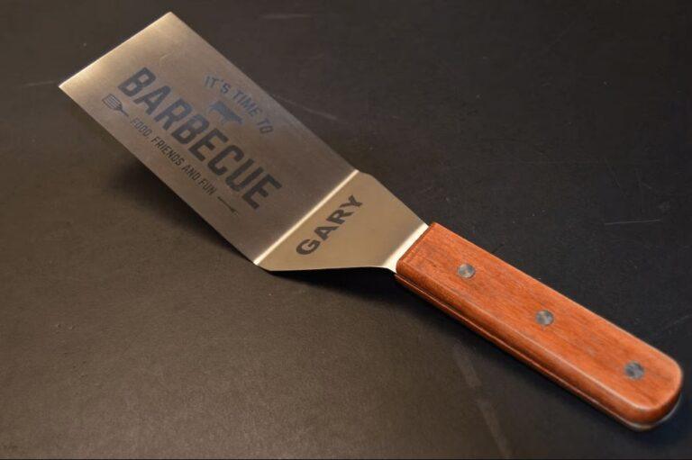 Engraved stainless steel BBQ spatula with wood handle, personalized with the name Gary and It's Time to Barbecue text, a retirement gift for Dad