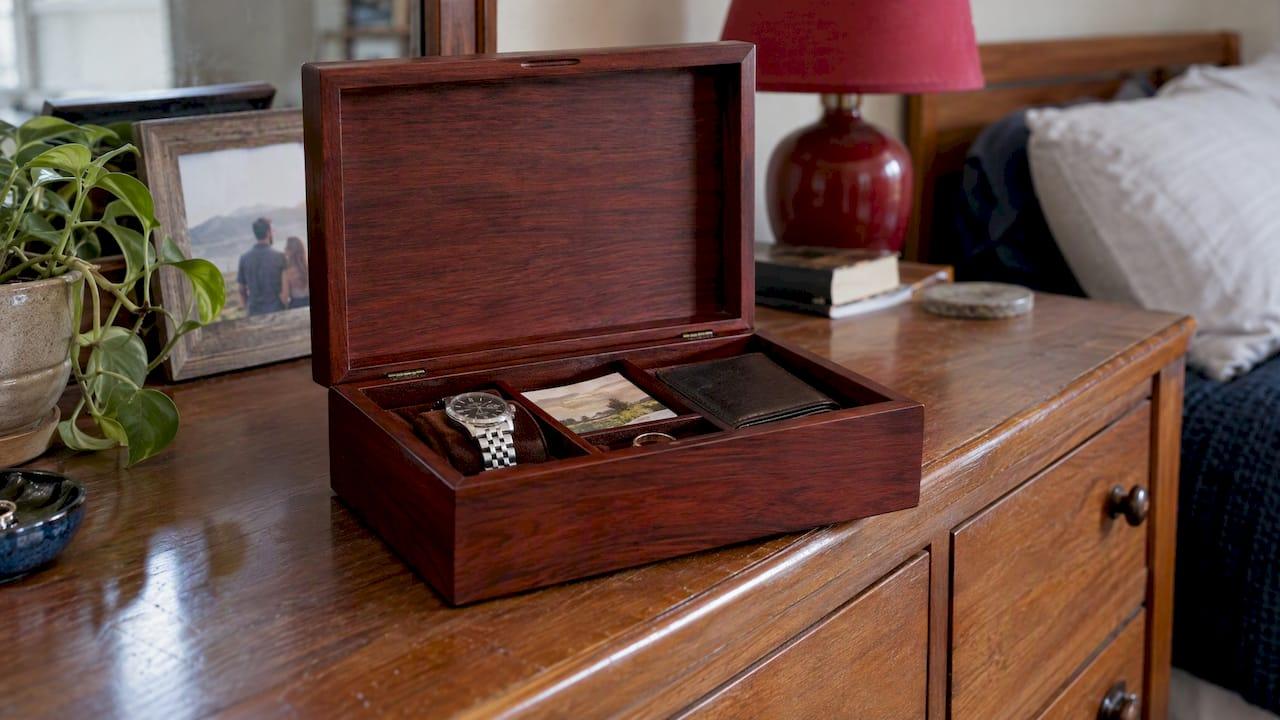 Open wooden keepsake box with personal mementos