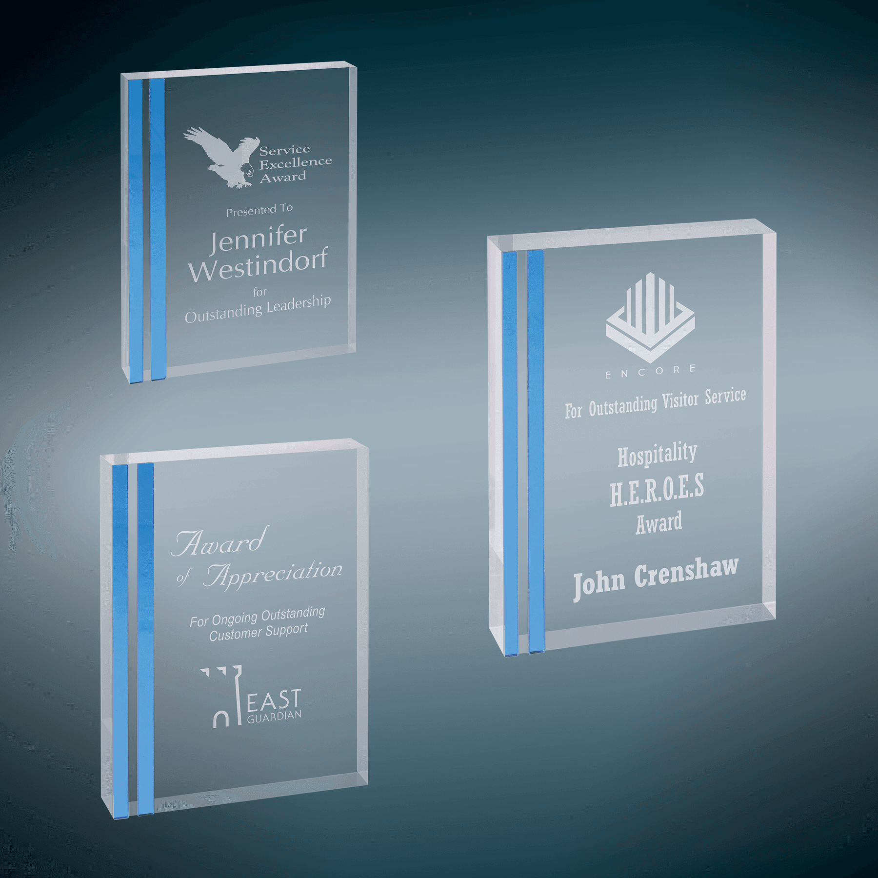 Engraved acrylic awards in two sizes with blue edges