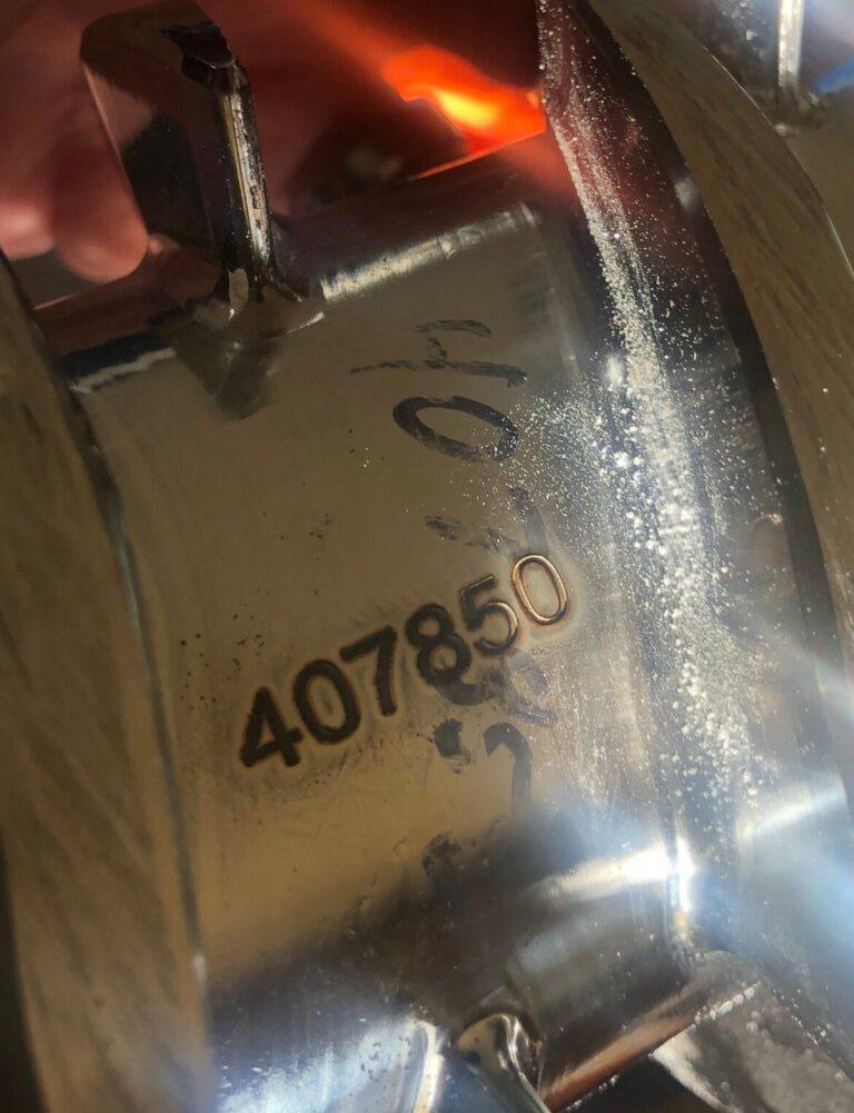 Serial number laser marked on a curved stainless steel part
