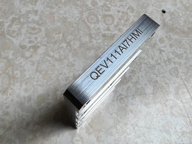 Part numbers laser marked on aluminum bar stock