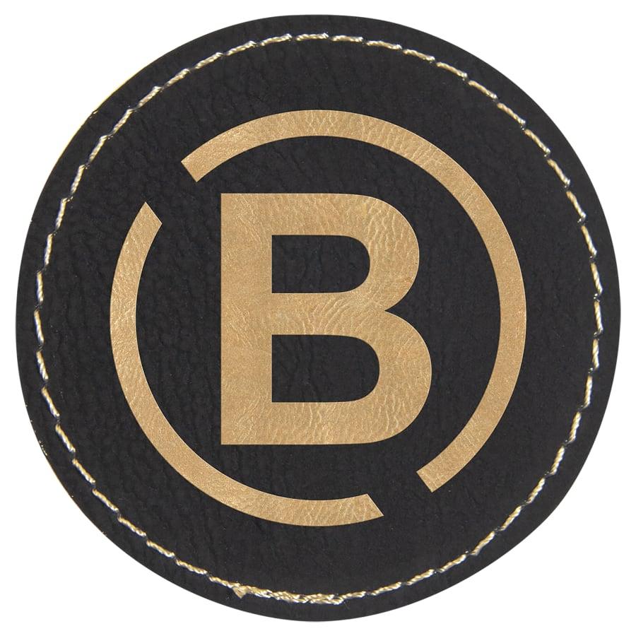 Laserable Leatherette Patch Blanks with Adhesive, Round and Oval (Packs) - 2 1/2" Round Black/Gold